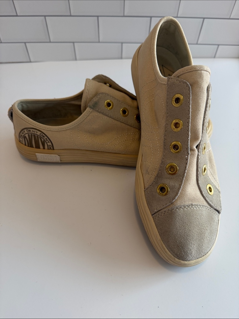 DKNY Beige Canvas Slip-On Sneakers with Gold Eyelets
